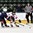GRAND FORKS, NORTH DAKOTA - APRIL 19: Switzerland's Philipp Kurashev #23 attempts to play the puck while fending off USA's Luke Martin #2 during  preliminary round action at the 2016 IIHF Ice Hockey U18 World Championship. (Photo by Minas Panagiotakis/HHOF-IIHF Images)

